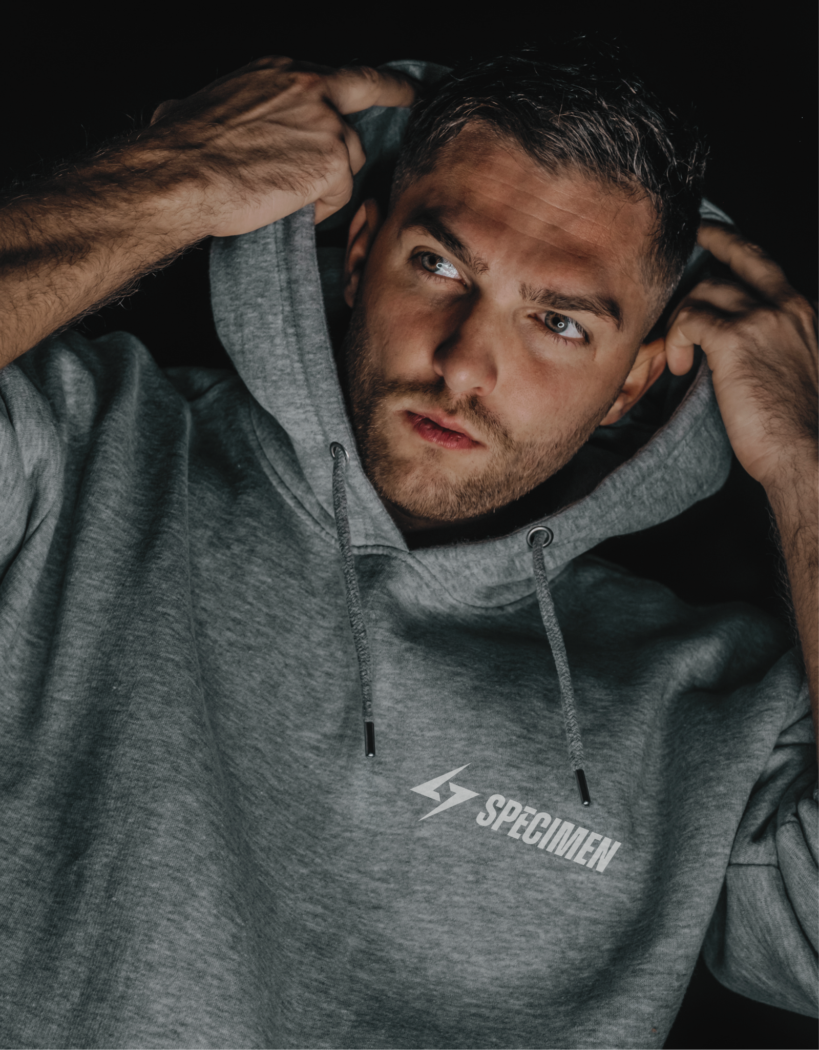 Athlete in Specimen technical hoodie — durable gym hoodie for performance and comfort